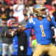 UCLA Bruins quarterback Dorian Thompson-Robinson (1) throws a pass against the Southern California Trojans in the first half at the Los Angeles Memorial Coliseum.